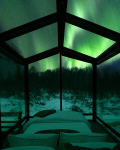 Northern Lights over Wilding Hotels panoramic glass lodge.
